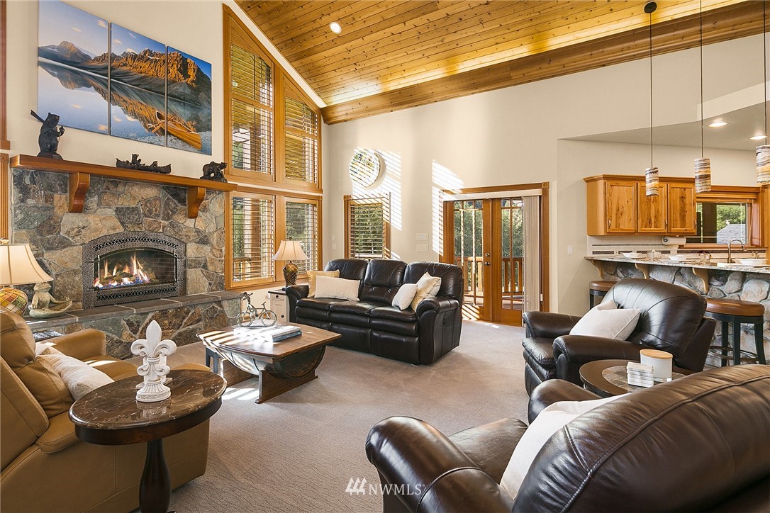 401 Highland Valley Road Morton, WA 98356 - Photo 12 of 39 a living room with furniture and a fireplace