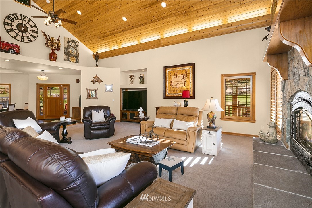 401 Highland Valley Road Morton, WA 98356 - Photo 13 of 39 a living room with furniture a fireplace and a flat screen tv