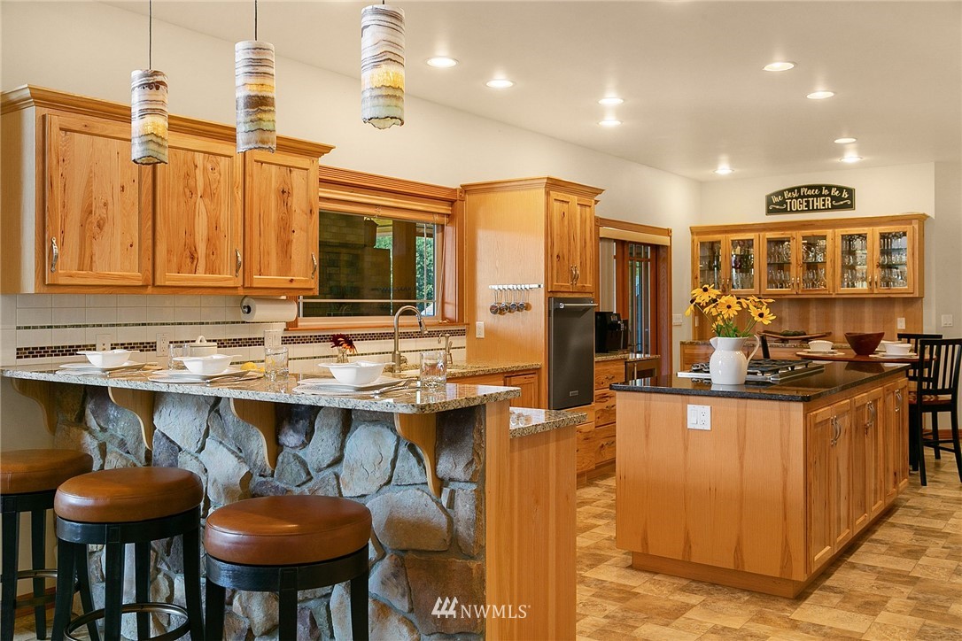401 Highland Valley Road Morton, WA 98356 - Photo 15 of 39 a kitchen with stainless steel appliances granite countertop a stove and a refrigerator