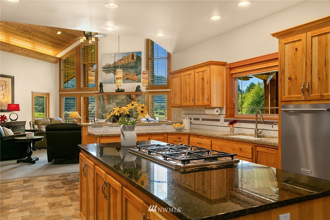 401 Highland Valley Road Morton, WA 98356 - Photo 17 of 39 a kitchen with stainless steel appliances granite countertop a stove and a sink