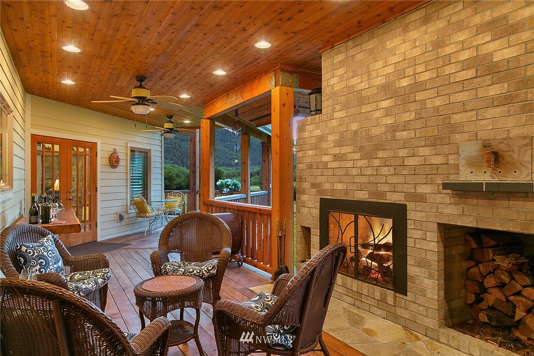 401 Highland Valley Road Morton, WA 98356 - Photo 20 of 39 a dining room with furniture and a fireplace