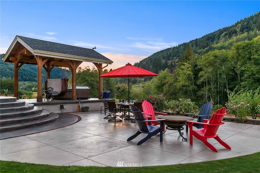 401 Highland Valley Road Morton, WA 98356 - Photo 30 of 39 a view of a chairs and table in patio with a yard
