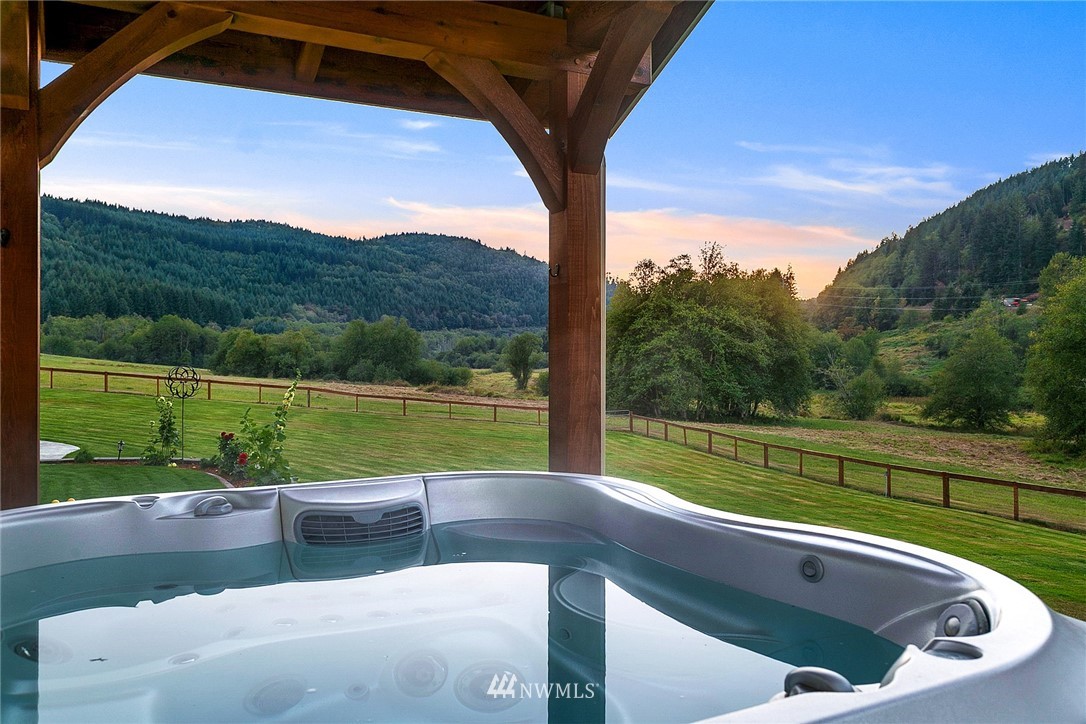 401 Highland Valley Road Morton, WA 98356 - Photo 31 of 39 a view of a swimming pool with a couches in a patio