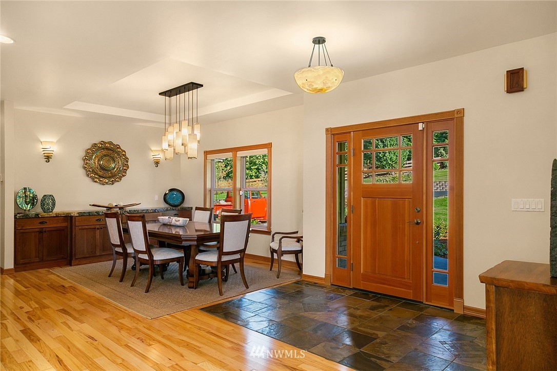 401 Highland Valley Road Morton, WA 98356 - Photo 9 of 39 a view of a dining room with furniture and chandelier