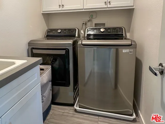 a utility room with closet dryer and washer