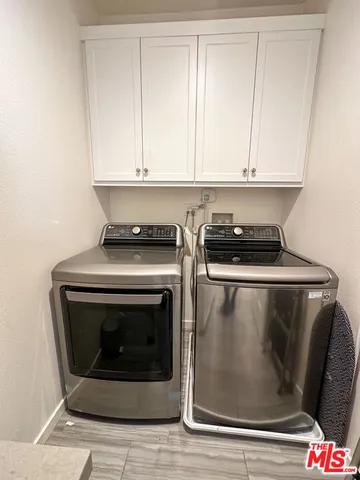 a stove top oven sitting inside of a kitchen