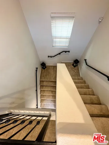 a view of a living room with a rug