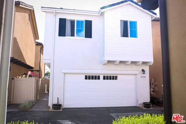 a front view of a house with a garage