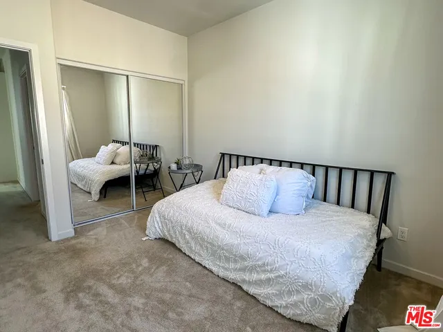 a bedroom with a bed and furniture