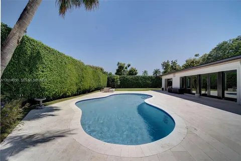 a view of a swimming pool with a patio