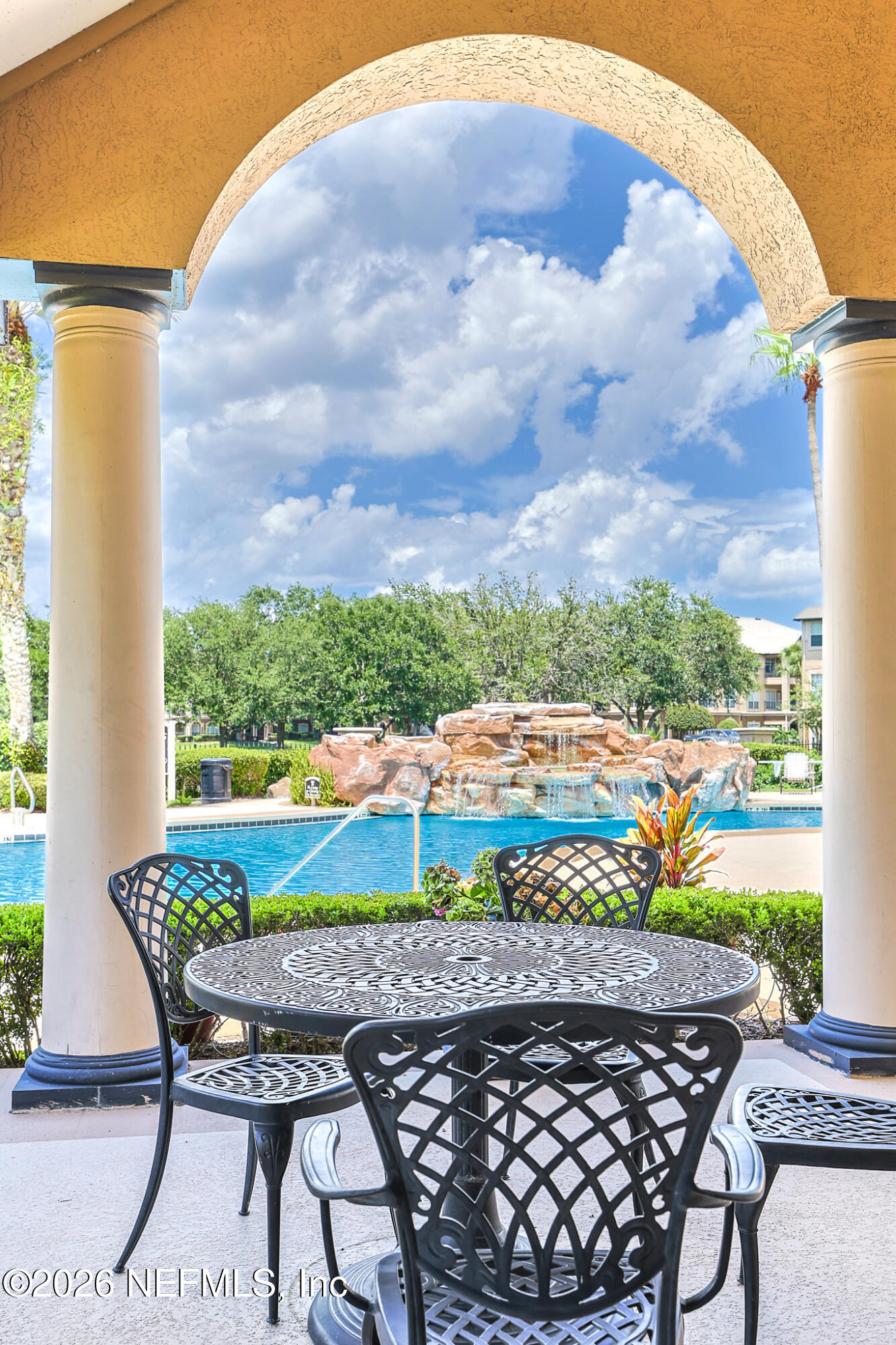 10961 Burnt Mill Road, Unit 426 Jacksonville, FL 32256 - Photo 16 of 24 a view of an outdoor sitting area with furniture and garden