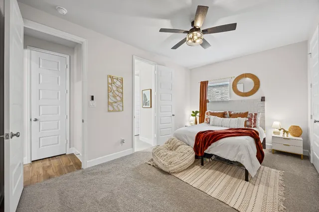 a bedroom with a bed and a couch