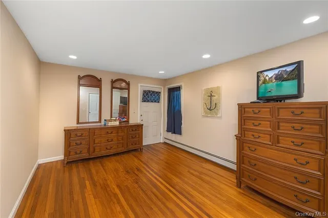 a view of room with wooden floor