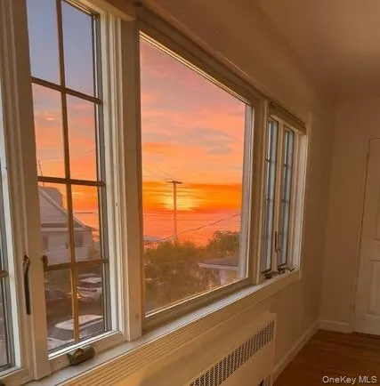a view of a room with a large window