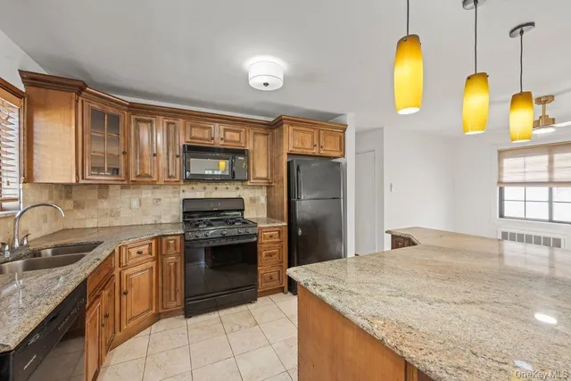 a view of a big room with wooden floor and a window