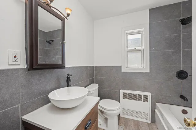 a kitchen with stainless steel appliances granite countertop a sink a stove top oven a counter space and cabinets