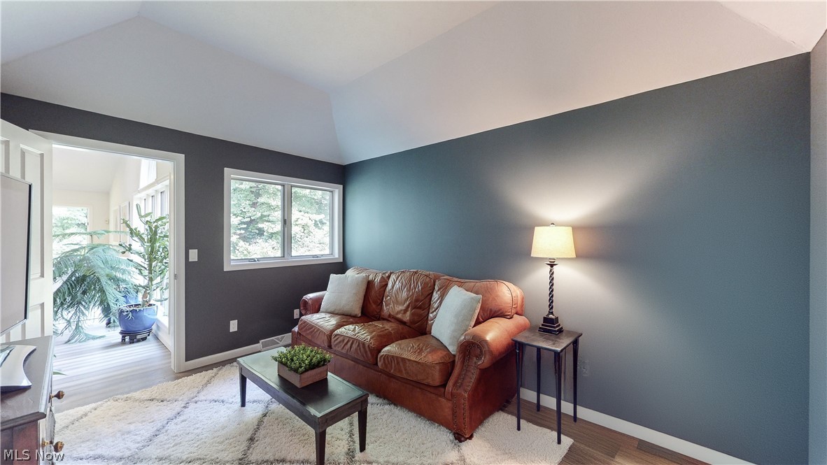 3700 Chagrin River Road Chagrin Falls, OH 44022 - Photo 11 of 43 Living room featuring vaulted ceiling and hardwood / wood-style floors