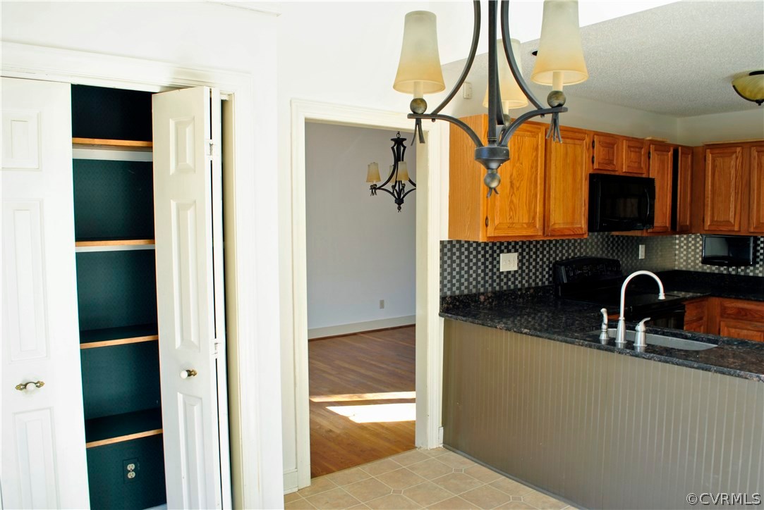 13902 North Point Road Midlothian, VA 23112 - Photo 5 of 36 a kitchen with a sink a refrigerator and a window