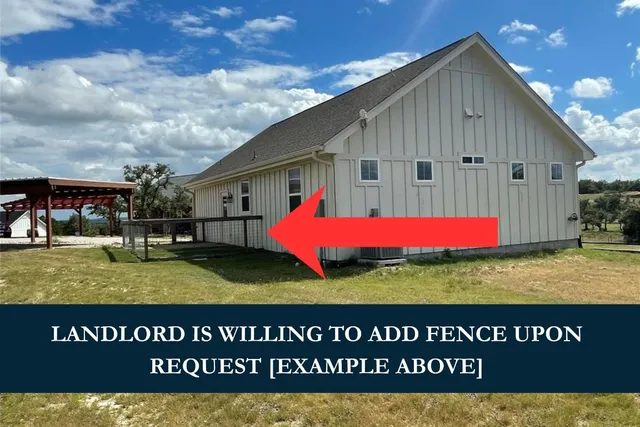 an empty room with windows and entrance