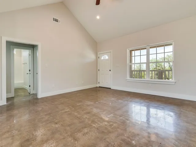 a view of a chair and table in the backyard