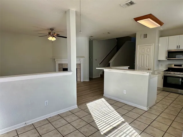 a view of a kitchen with storage and utility