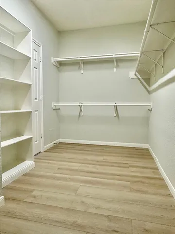 a view of an empty walk in closet