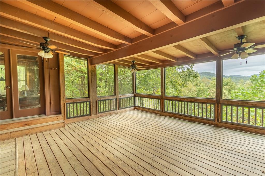 a view of porch with wooden floor