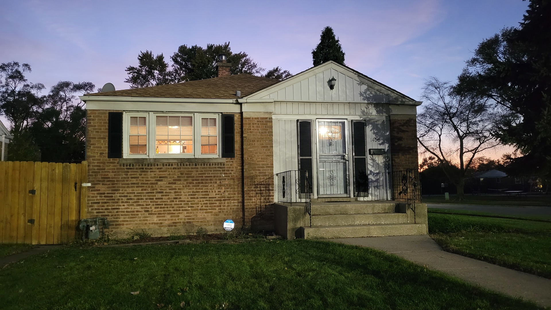 1400 Gardner Road Westchester, IL 60154 - Photo 1 of 12 a front view of a house with a garden
