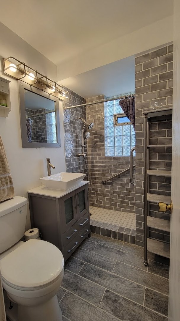 1400 Gardner Road Westchester, IL 60154 - Photo 5 of 12 a bathroom with a sink toilet and shower