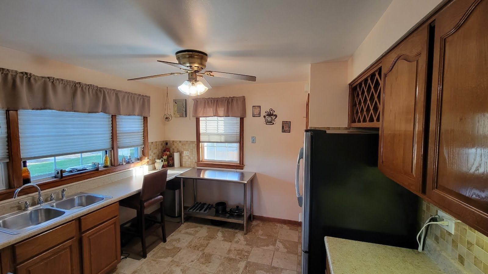 1400 Gardner Road Westchester, IL 60154 - Photo 6 of 12 a kitchen with sink refrigerator and window
