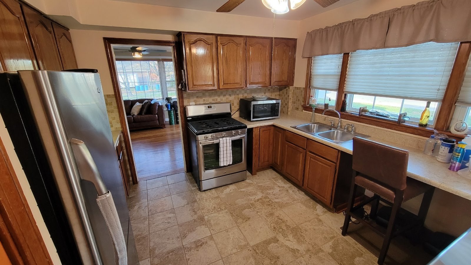 1400 Gardner Road Westchester, IL 60154 - Photo 7 of 12 a kitchen with stainless steel appliances granite countertop a refrigerator a stove a sink and dishwasher