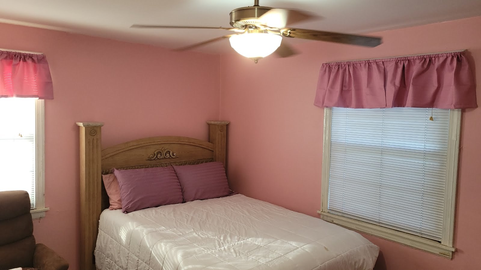 1400 Gardner Road Westchester, IL 60154 - Photo 8 of 12 a bedroom with a bed and a chandelier