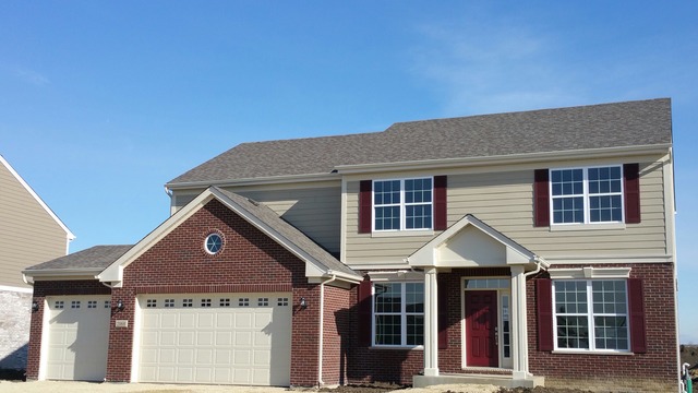 2068 Stapleton Road New Lenox, IL 60451 - Photo 1 of 12 a front view of a house with a yard