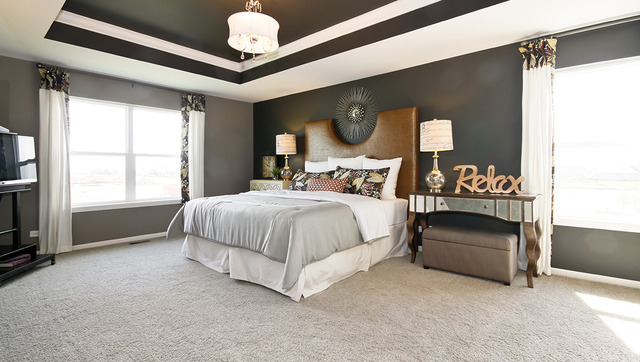 2068 Stapleton Road New Lenox, IL 60451 - Photo 7 of 12 a bedroom with bed and a chandelier