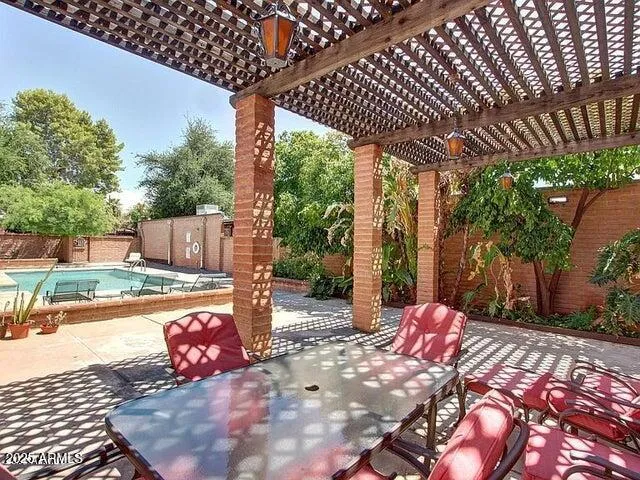 a view of a backyard with a sitting area