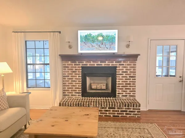 a front view of a house with large windows