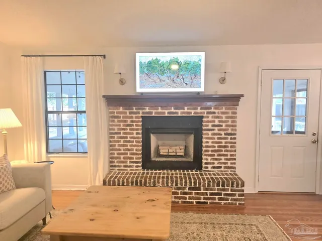 a front view of a house with large windows