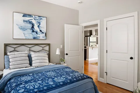 a bedroom with a rug and bed