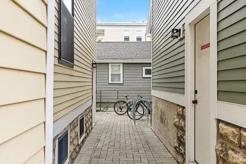 a view of a porch with wooden floor