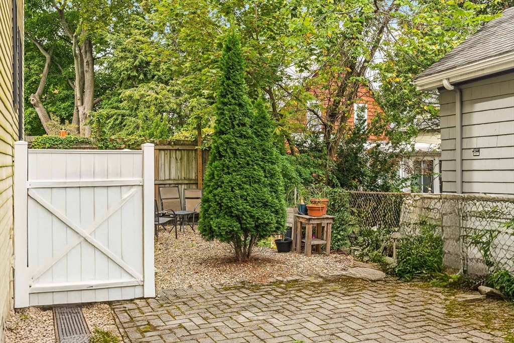 51 Dudley Street, Unit 2 Cambridge, MA 02140 - Photo 23 of 25 a house with trees in front of it
