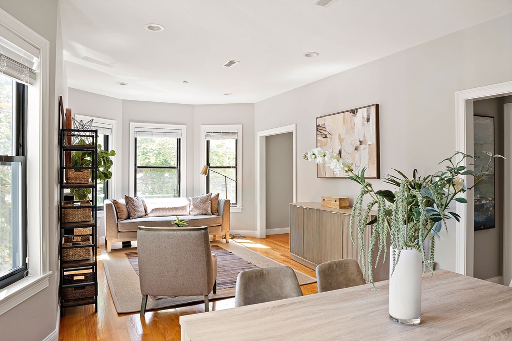 51 Dudley Street, Unit 2 Cambridge, MA 02140 - Photo 8 of 25 a view of a dining room with furniture and a potted plant