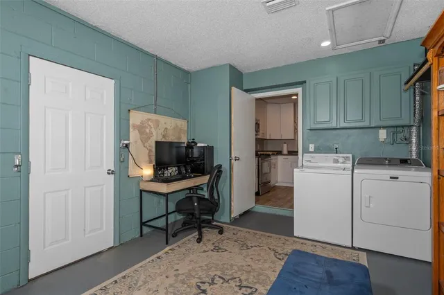 a room with a chair and a stove top oven