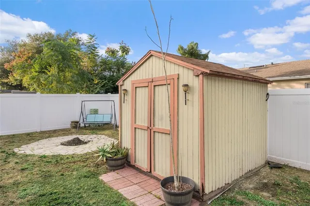 a front view of a house with a garden and porch