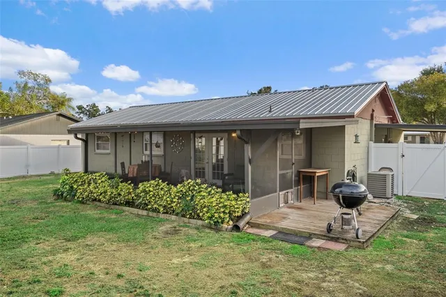 a view of a house with yard and a garden