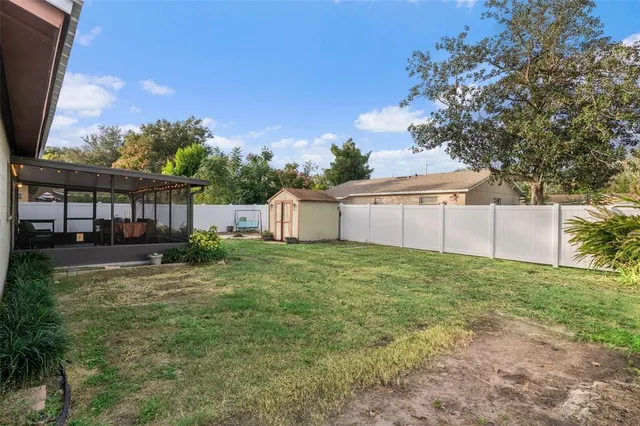 a view of a house with a yard and garage