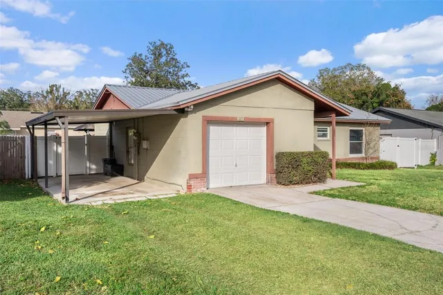 a front view of house with yard and green space