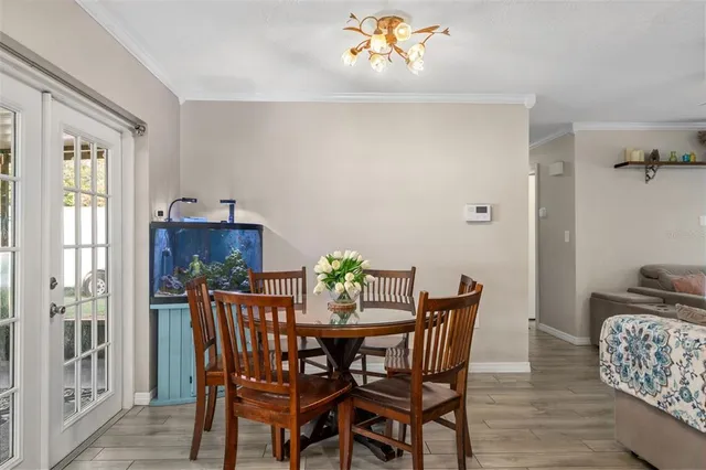 a dining room with furniture and window