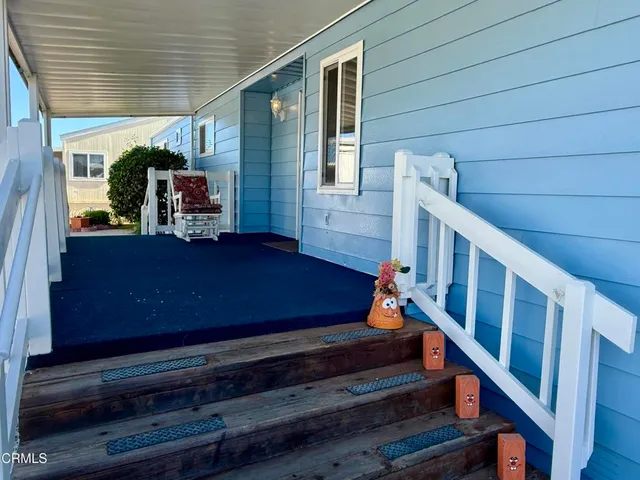 a view of entryway with wooden stairs