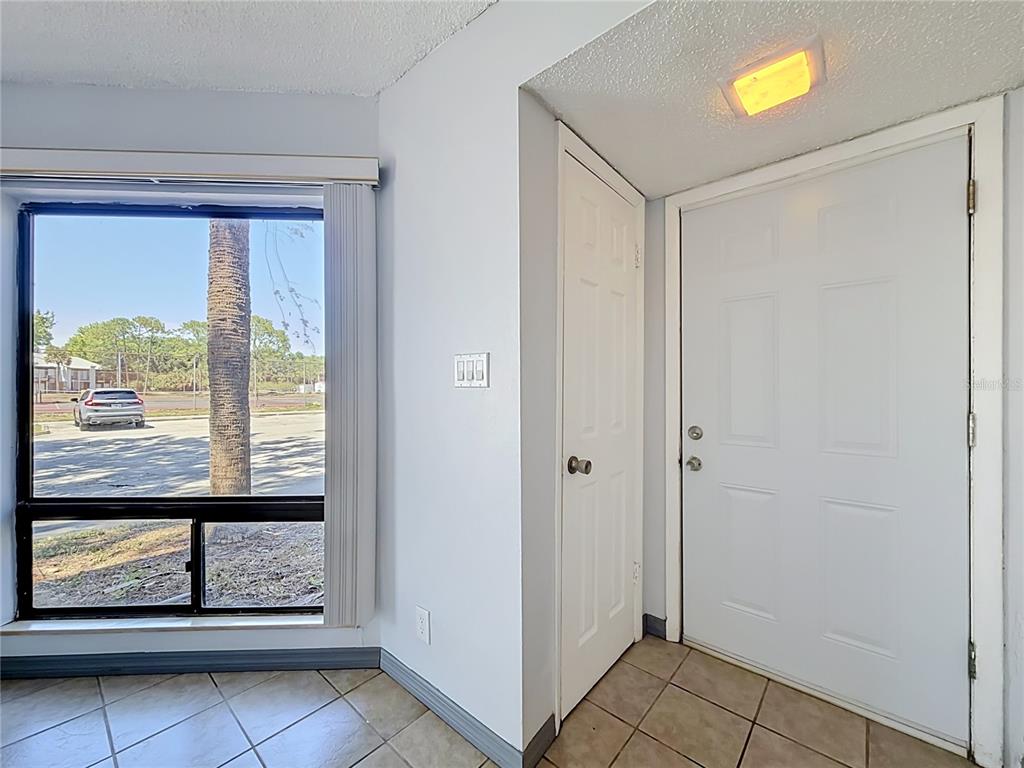 2636 Lemon Tree Lane, Unit 2636 Orlando, FL 32839 - Photo 14 of 51 a view of entryway with an empty room and window