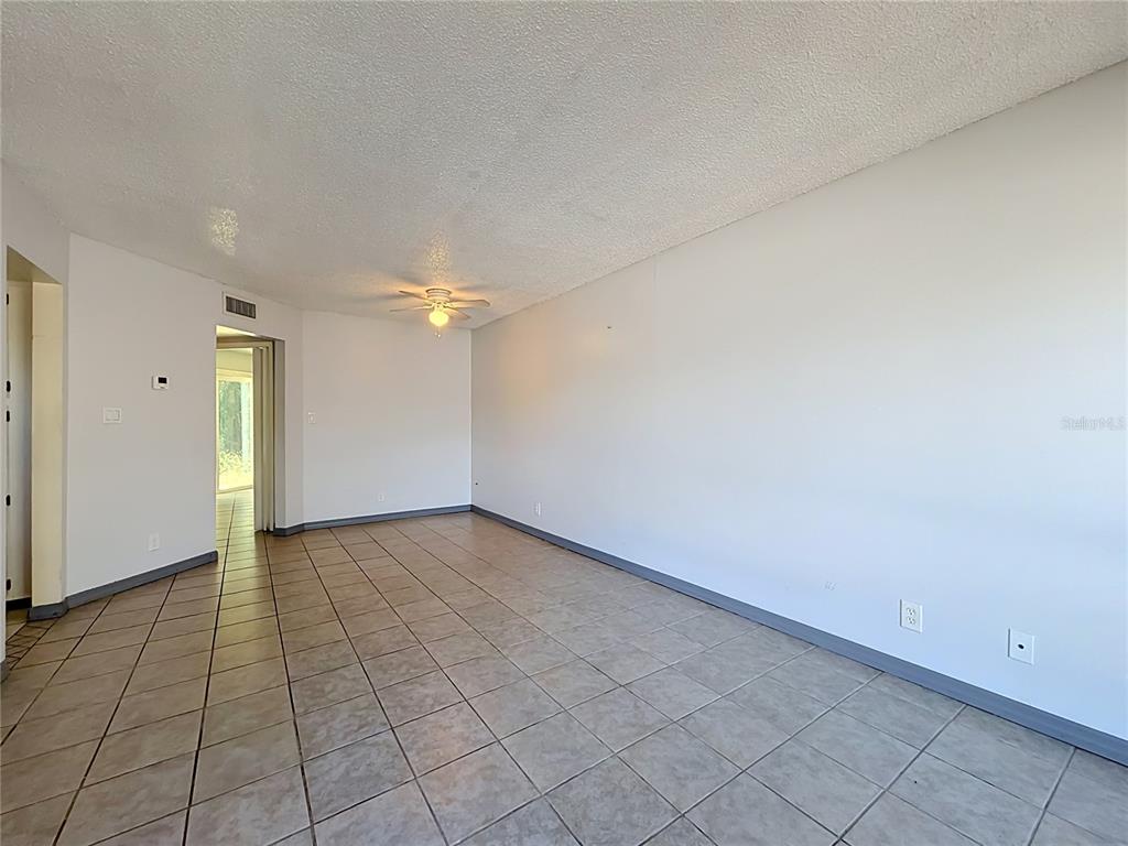2636 Lemon Tree Lane, Unit 2636 Orlando, FL 32839 - Photo 15 of 51 an empty room with a empty space